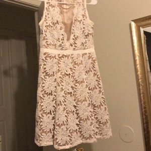 Midi dress features embroidered flowers fabric!